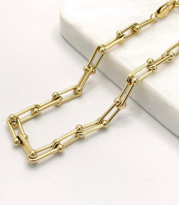 18K Gold Filled U-link Bracelet on white coaster