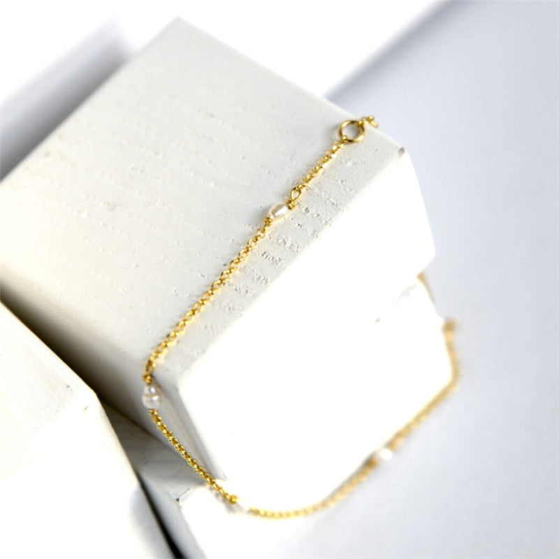 14K Gold filled Pearls and chain bracelet on wooden cubes.