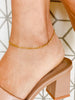 Woman with heels wearing gold plated Figaro Anklet from NAZ Parure