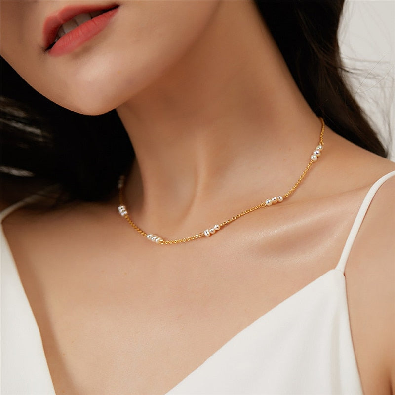 Fancy white dress with 14K Gold-Filled Pearl Pattern Necklace ideal for weddings, formals and graduations.