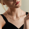 Gold Woman in little black dresss wearing 14K Gold-Filled Pearl Pattern Necklace for party.
