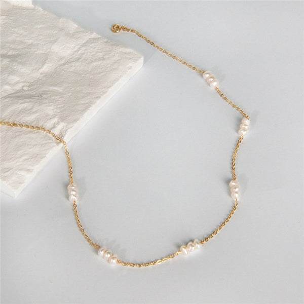 14K Gold-Filled Pearl Pattern Necklace with stone background. 
