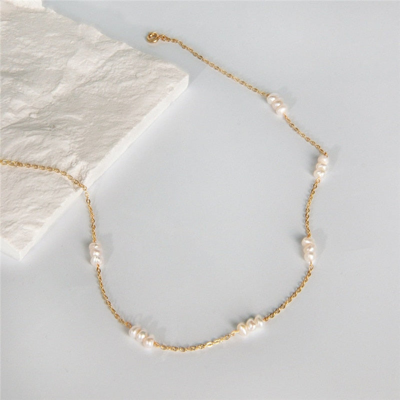 14K Gold-Filled Pearl Pattern Necklace with stone background. 