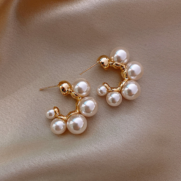 Pearl Hoops on satin background 