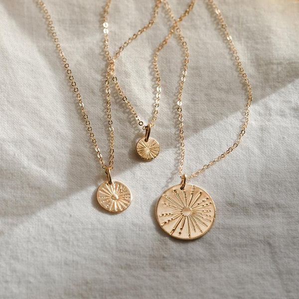Dainty and Delicate 14K Gold-filled Sunbeam Coin Necklaces available in 9mm, 13mm, and 16mm coin sizes.