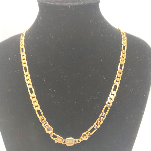 24K gold plated Bold Figaro Chain on a necklace stand. 