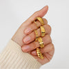 Thin Chain Ring with several rings including Croissant Ring from NAZ Parure.