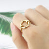 Index finger with 18K Gold plated Unity Ring from NAZ Parure