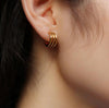 Woman wearing Triple Hoop Earrings