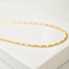 14K gold filled Chain Link Necklace on white stone.
