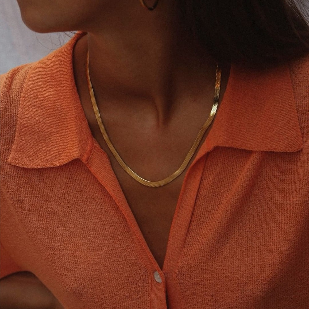 Woman wearing the classic Herringbone Necklace from NAZ Parure Jewelry