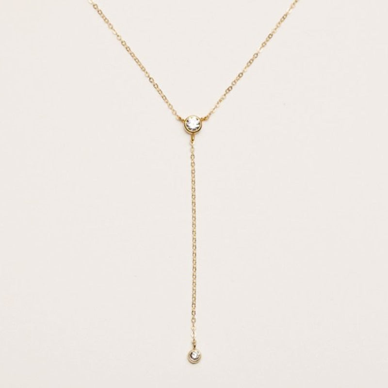 14K Gold filled Zirconia Y Necklace on white background.