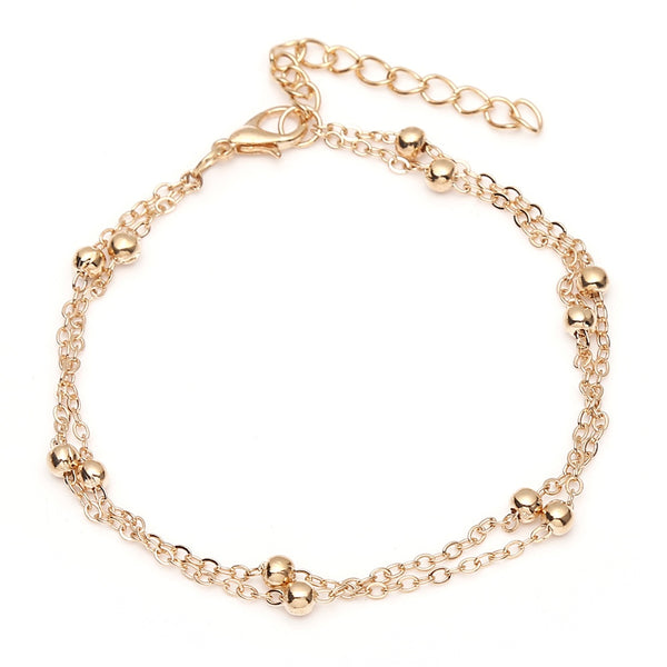 Rose gold Ball and Chain Anklet against white background from NAZ Parure