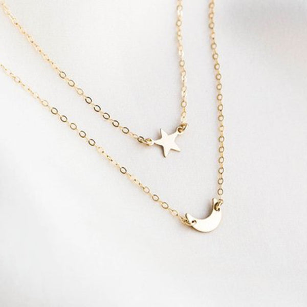 14K Gold filled Star necklace and celestial moon necklace on white background.