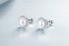 Close up of Halo Pearl Studs from NAZ Parure.