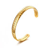 Gold plated Wheat Cuff Bangle on white background.