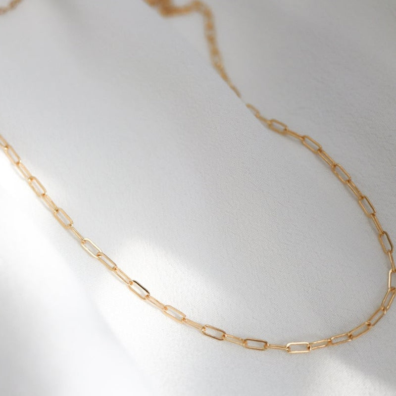 14K Gold-Filled Oval Link Chain on white background ideal to wear during workouts, gym, and showers