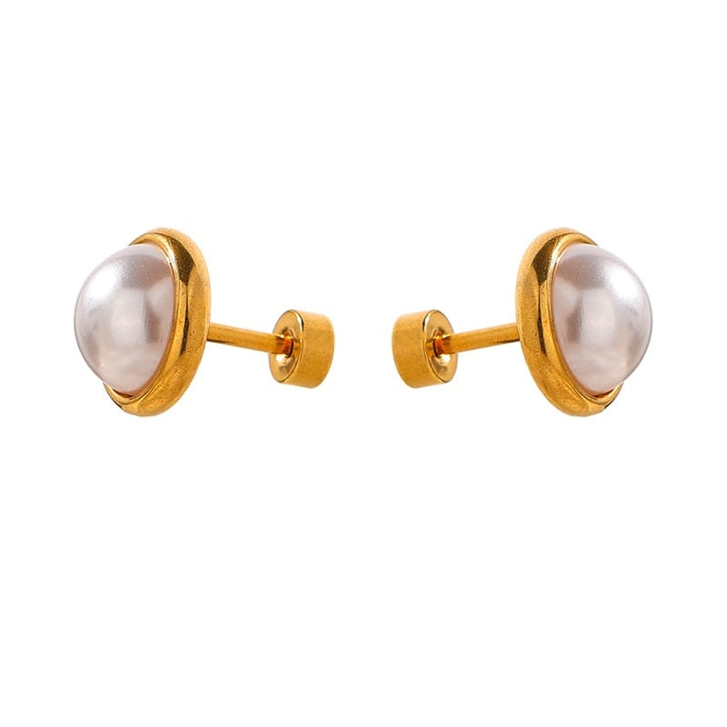 Pearl with Gold Halo Studs from NAZ Parure on white background.