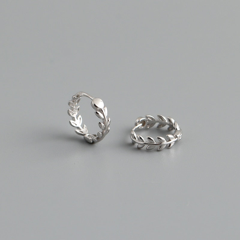 Sterling silver Leaves of Gold Earrings on gray background.