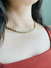 Woman showing one way to wear Rope Chain with Pearls necklace by showing rope chain only. 