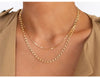 Woman in khaki top wearing 14K gold filled chain link necklace and thick figaro chain. 