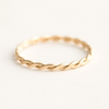 14K Gold-FIlled Thin Braid Ring on a white background available in size 6, 7, and 8. 