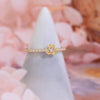14K Gold Plated Delicate Rose Ring on a velvet ring stand.