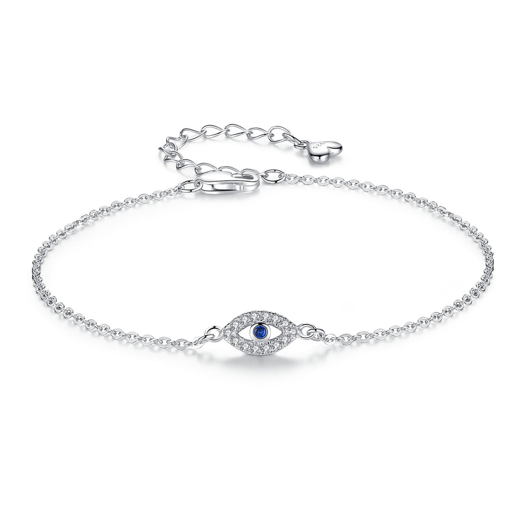 Dainty 925 Sterling silver Evil Eye Bracelet with zirconia bordering blue gem in center.