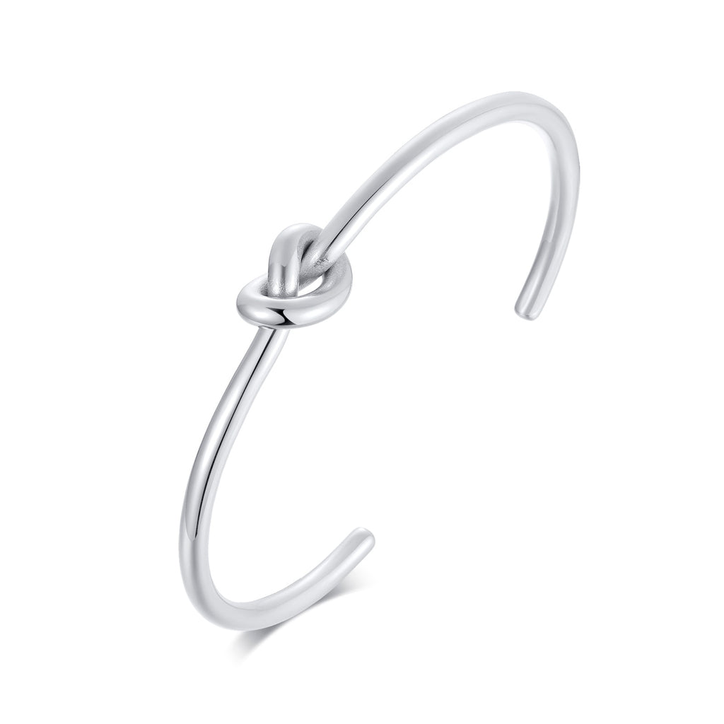Stainless steel Timeless Knot Cuff Bangle against white background.