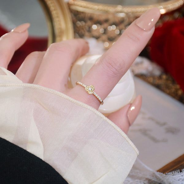Woman wearing Delicate Rose Ring on index finger