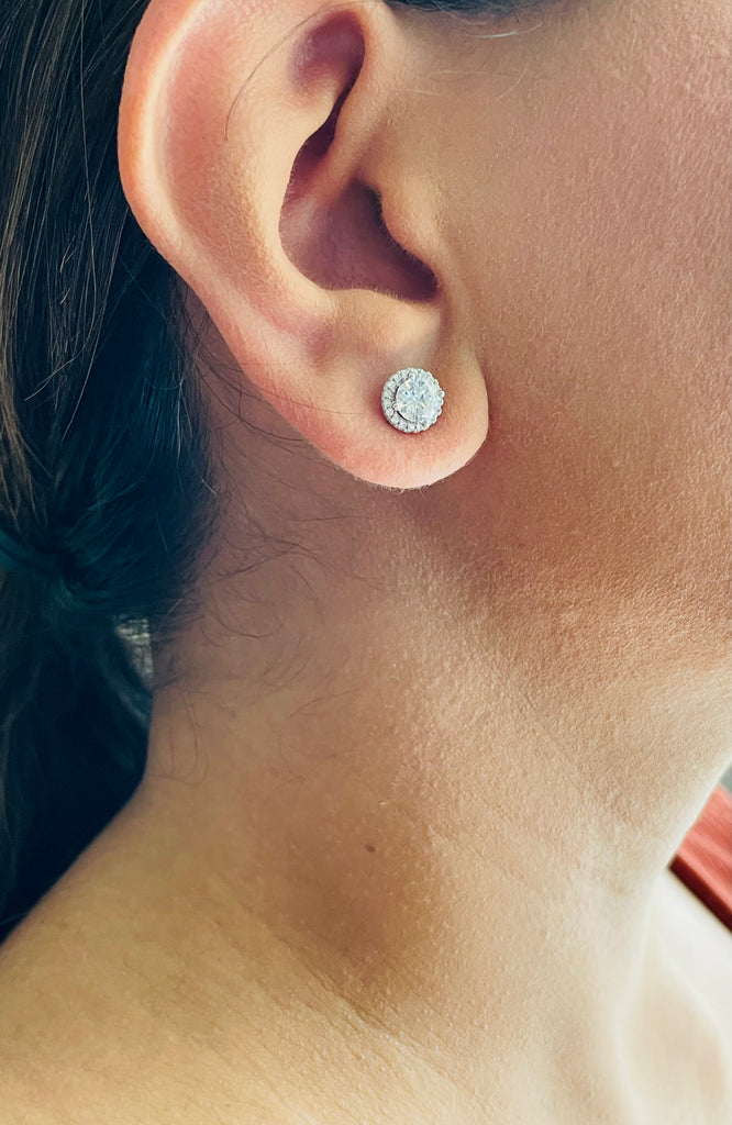Woman wearing Halo Solitaire Studs from NAZ Parure.
