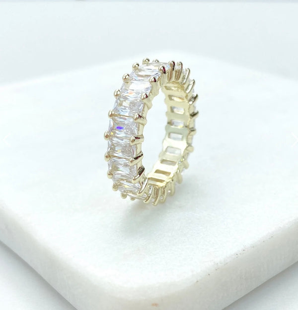 18K Gold Filled emerald cut ring on white coaster.