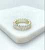 18K Gold FIlled Emerald cut ring laying flat on white marble.